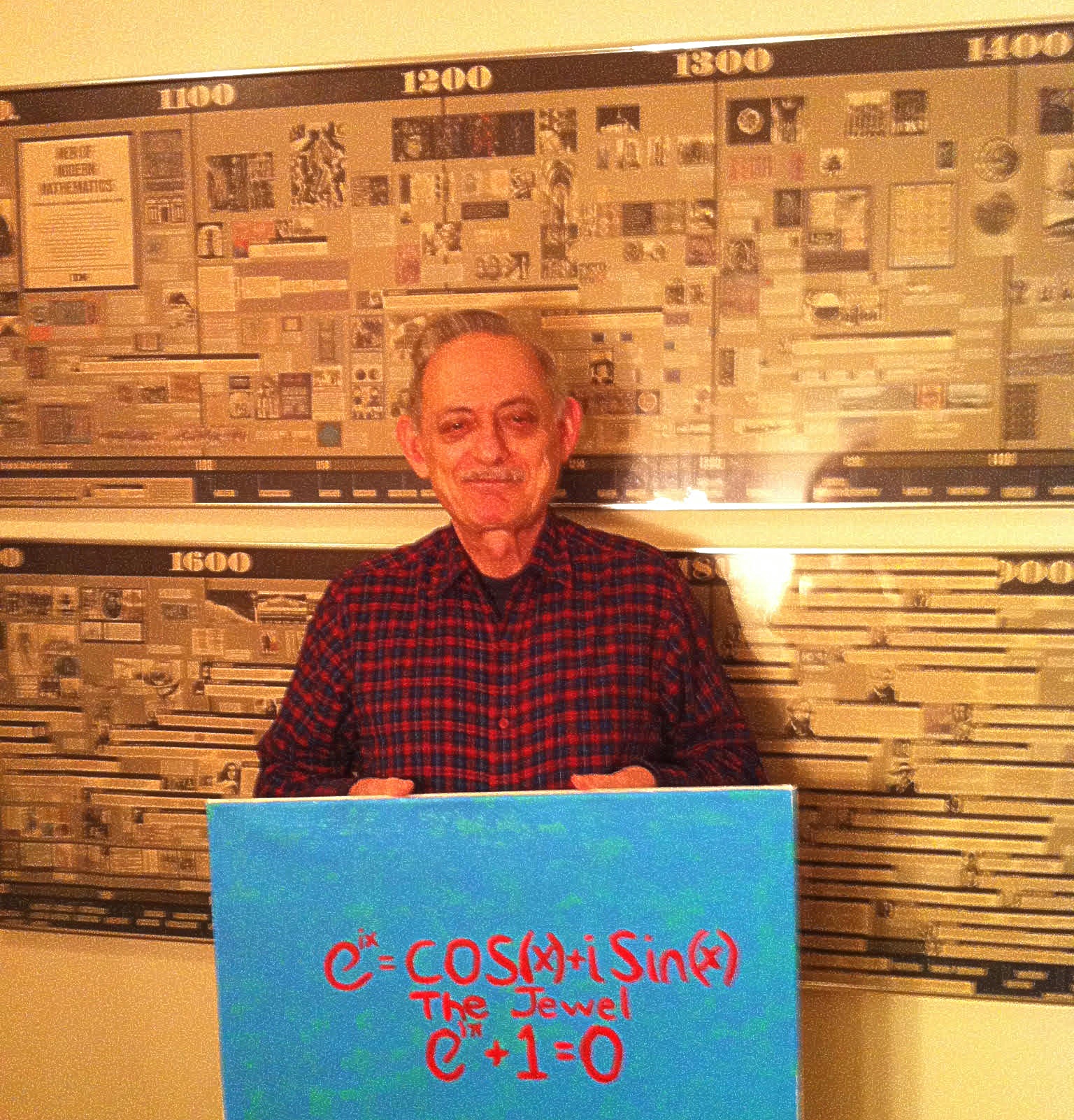 Moshe holding his young daughter's poster of The Jewel". (Enlarged)